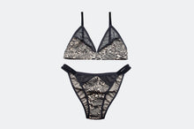 Load image into Gallery viewer, Black and beige leopard print lingerie set on a light gray background
